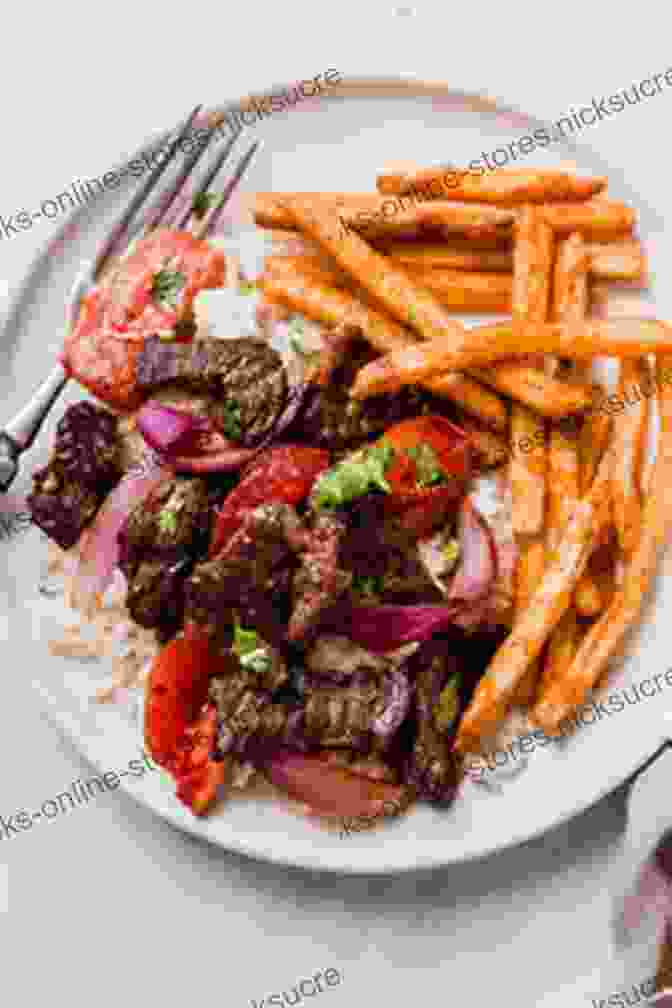 A Colorful Dish Of Lomo Saltado, A Classic Peruvian Stir Fry Featuring Beef, Onions, Tomatoes, And Aji Peppers JGV: A Life In 12 Recipes