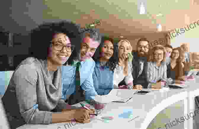 A Group Of Employees Smiling And Working Together In A Well Lit Office. Reimagining Workplace Well Being: Fostering A Culture Of Purpose Connection And Transcendence